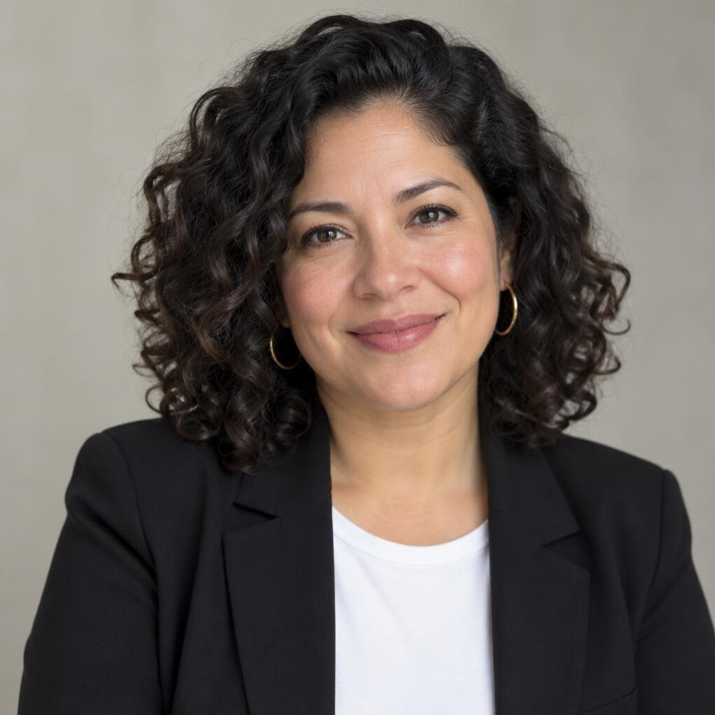 Portrait of a Latina woman producer and archivist smiling
